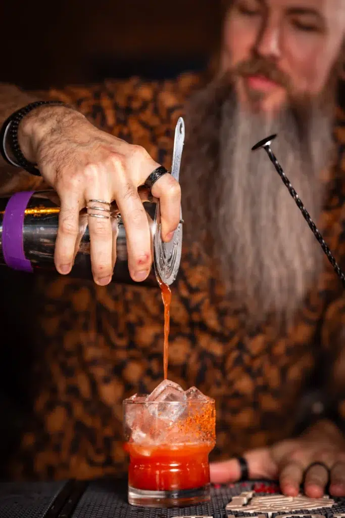 Bartender pouring the Garden Witch one of the best margaritas near Fort Lauderdale - revelryfla.com Bartender pouring the Garden Witch one of the best margaritas near Fort Lauderdale
